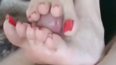 a hot lady doing footjob